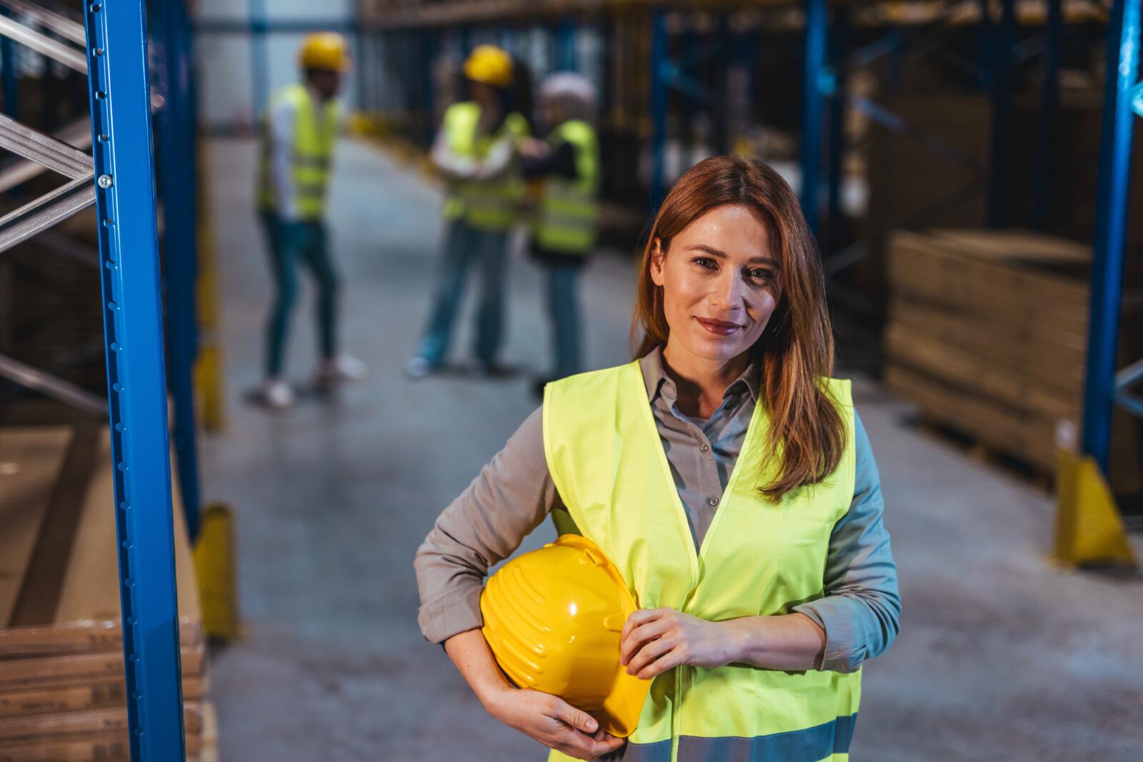 A,Professional,Woman,In,A,Safety,Vest,Is,Holding,A