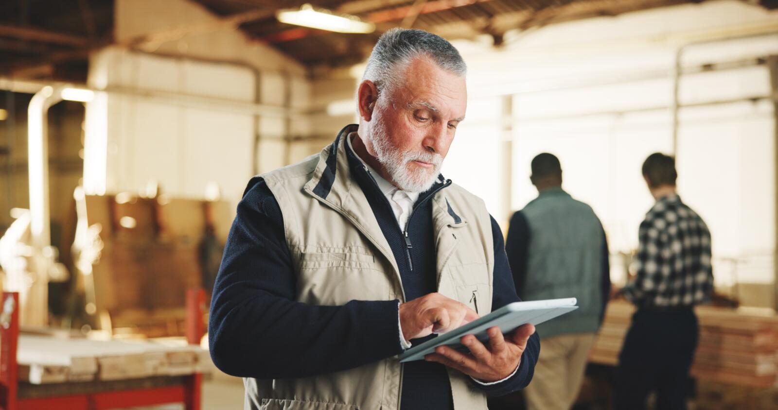 Carpenter,,Man,And,Typing,In,Factory,With,Tablet,,Research,And